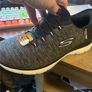 Skechers Woman’s Black and White Sneakers